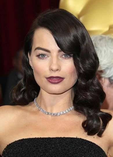 Margot Robbie wearing glamorous brunette curls